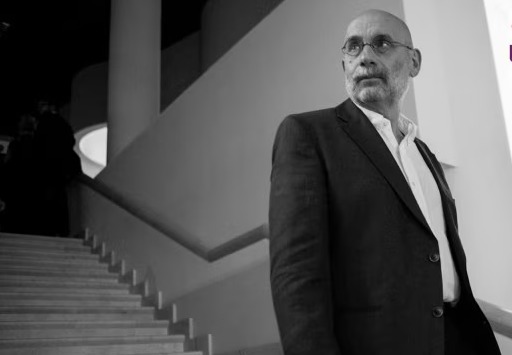 Boris Akunin speaking at a literary event, highlighting his role as both writer and political critic